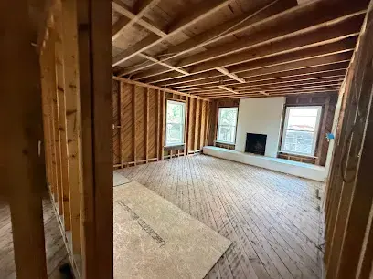Room opened to the studs and ceiling joists during a Kernersville water damage dry-out