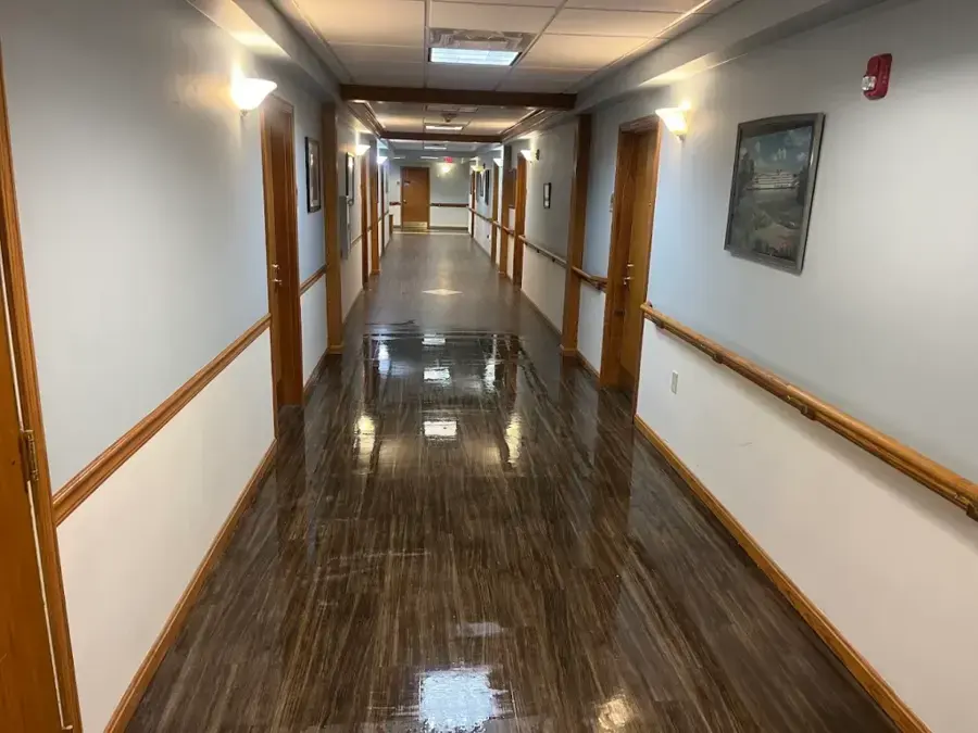 Long wet corridor in a Kernersville commercial building after a water loss